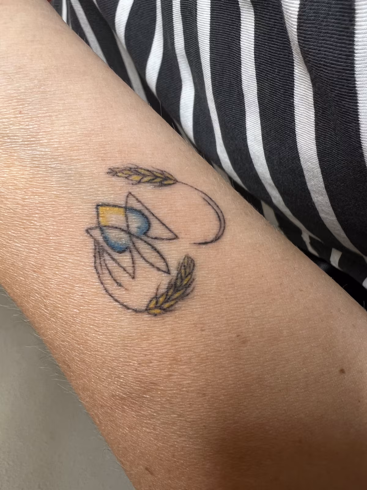Delicate fine-line tattoo example